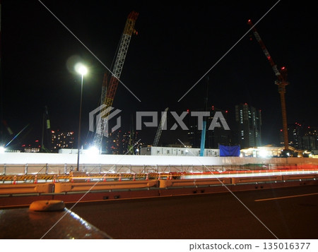 Large construction site in the city at night 135016377