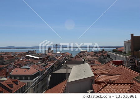 Wide Cityscape of Lisbon with Red Roofs and Tagus River Estuary Wide Cityscape of Lisbon with Red Roofs and Tagus River Estuary 135016961