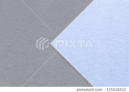 Textured gray paper background, half two colors with pastel blue arrow, macro. Template with copy space for banner 135018332