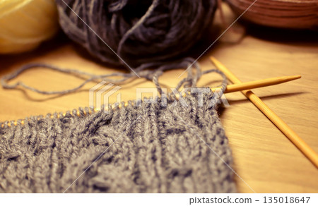Photo of cable knitting in progress with knitting needles. Knitting, Yarn, Aran pattern, Hobby 135018647