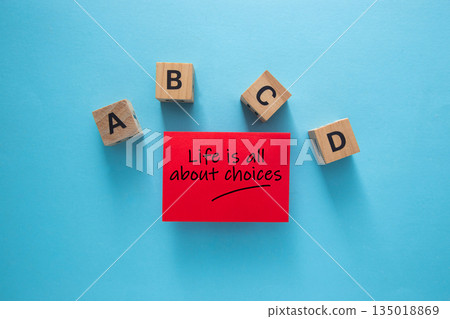 Red sticky note saying life is all about choices Red sticky note saying life is all about choices 135018869