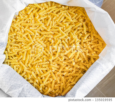 Bulk pasta at a grocery supermarket, dry bulk pasta at a grocery store 135019595