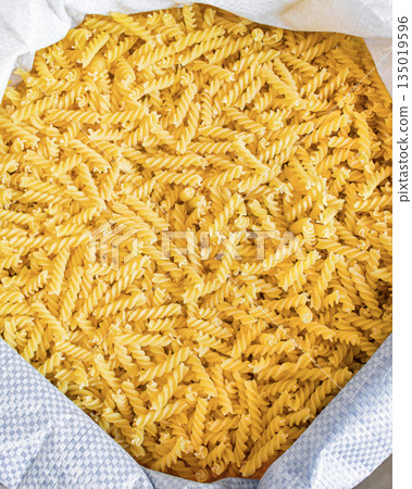 Bulk pasta at a grocery supermarket, dry bulk pasta at a grocery store 135019596