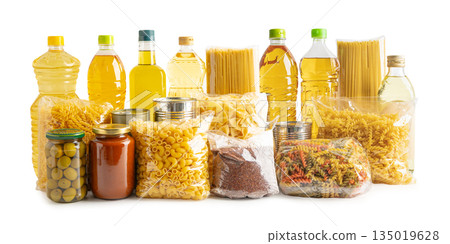 Foodstuff for donation, storage and delivery. Various food, pasta, cooking oil and canned food in cardboard box. 135019628