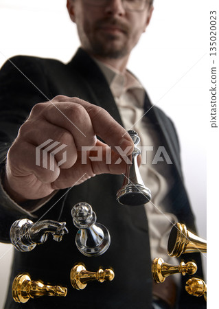 Business leader selecting chess move from floating board. Business leader selecting chess move from floating board. 135020023