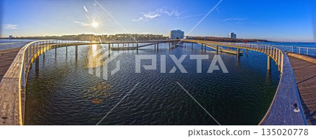 Curved pier at Timmendorfer Strand on the Baltic Sea Curved pier at Timmendorfer Strand on the Baltic Sea 135020778