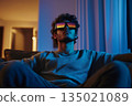 Man Wearing 3D Glasses Immersed in Watching 3D TV 135021089