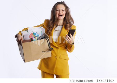 Joyful Businesswoman Laughing with Moving Box Joyful Businesswoman Laughing with Moving Box 135021102