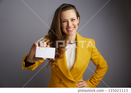 Professional Woman Offering Business Card 135021113