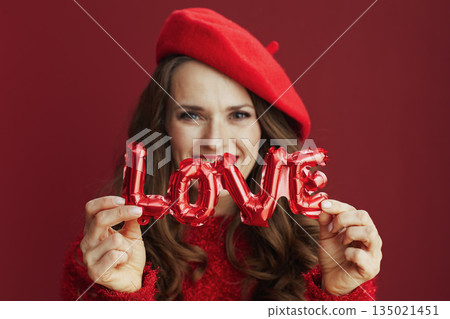 happy stylish 40 years old woman in red sweater and beret happy stylish 40 years old woman in red sweater and beret 135021451