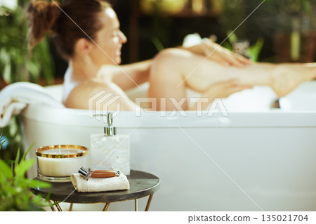 Woman Relaxing in Bathtub: Self-Care Ritual 135021704