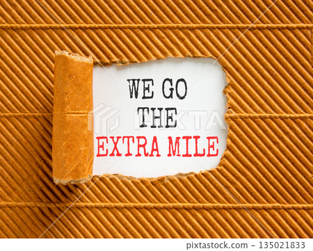 Support, help we go the extra mile symbol. Concept words We go the extra mile on beautiful white paper. Beautiful brown paper background. Business we go the extra mile concept. Copy space. Support, help we go the extra mile symbol. Concept words We go the extra mile on beautiful white paper. Beautiful brown paper background. Business we go the extra mile concept. Copy space. 135021833