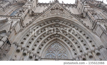 Detailed facade of the barcelona cathedral entrance, made on stone in gothic architectural style Detailed facade of the barcelona cathedral entrance, made on stone in gothic architectural style 135022066