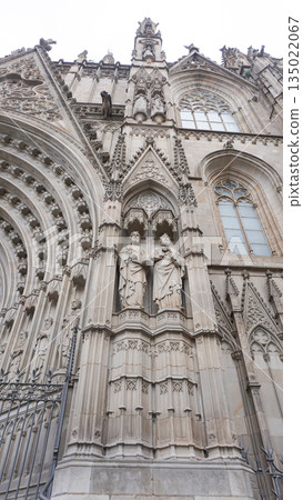 Detailed facade of the barcelona cathedral entrance, made on stone in gothic architectural style 135022067