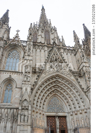 Detailed facade of the barcelona cathedral entrance, made on stone in gothic architectural style Detailed facade of the barcelona cathedral entrance, made on stone in gothic architectural style 135022086