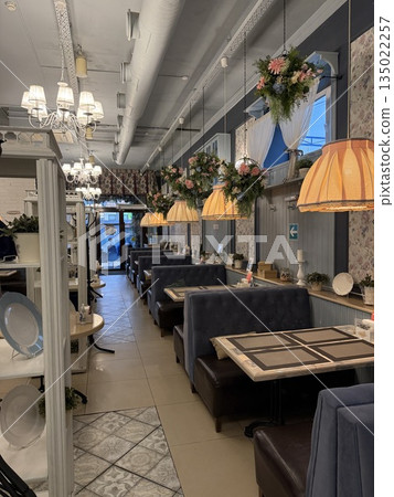 Cozy restaurant interior with festive decorations and elegant lighting, suitable for background use Cozy restaurant interior with festive decorations and elegant lighting, suitable for background use 135022257