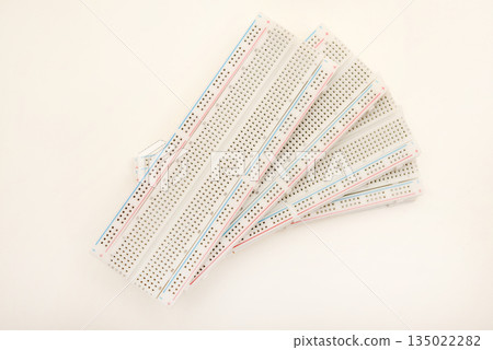 A solderless board for electronics. A breadboard for experiments in electronics. A solderless board for electronics. A breadboard for experiments in electronics. 135022282