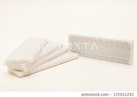 A solderless board for electronics. A breadboard for experiments in electronics. A solderless board for electronics. A breadboard for experiments in electronics. 135022283