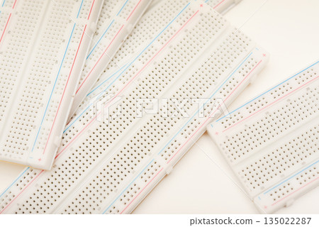 A solderless board for electronics. A breadboard for experiments in electronics. 135022287