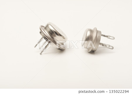 An old bipolar transistor. A bipolar transistor in a metal case. A powerful transistor. An old bipolar transistor. A bipolar transistor in a metal case. A powerful transistor. 135022294