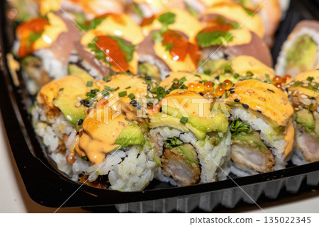 Japanese sushi assortment in plastic takeaway tray 135022345