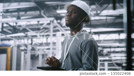 Dedicated Technician Concerned Expression While Holding Tablet, Suggesting Troubleshooting 135022406