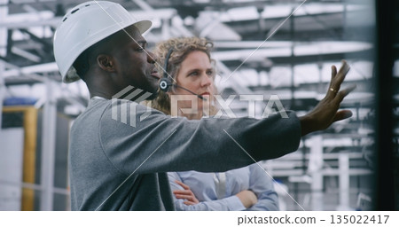 Male Engineer With Tablet Reports to Female Technical Support Manager on Productivity 135022417