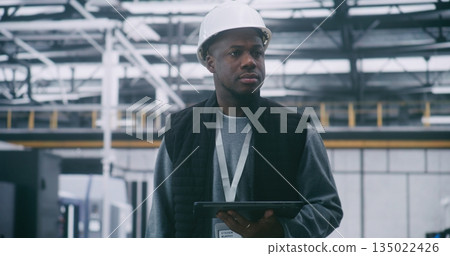 Technical Supervisor in Protective Hard Hat Audits System Performance With Tablet Technical Supervisor in Protective Hard Hat Audits System Performance With Tablet 135022426
