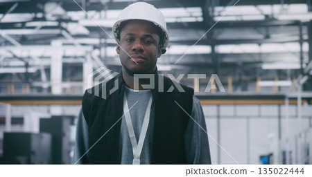 Male Industrial Specialist Wearing White Helmet and Vest 135022444