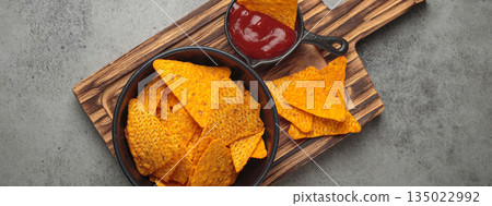 Nachos tortilla chips salsa dip wooden board Mexican Tex-Mex snack fast food 135022992