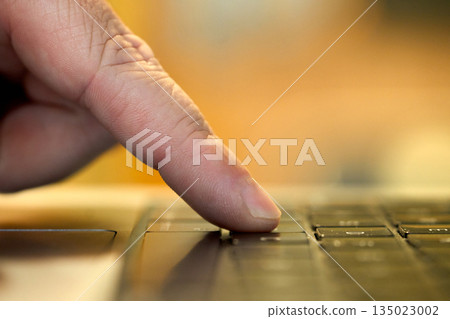 Person presses a button on a keyboard Person presses a button on a keyboard 135023002