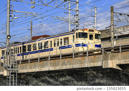 Local train travels over a bridge in Kitakyushu, Fukuoka Japan. Local train travels over a bridge in Kitakyushu, Fukuoka Japan. 135023055