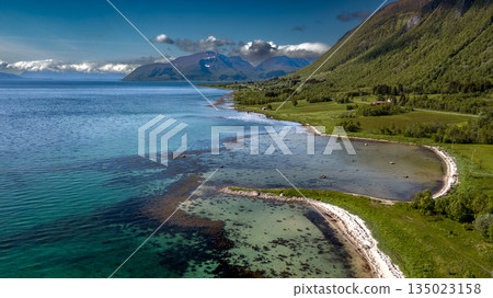 Coastal Landscape In Aerial View With Fjord And Snowy Mountains On Lofoten Islands In Norway Coastal Landscape In Aerial View With Fjord And Snowy Mountains On Lofoten Islands In Norway 135023158