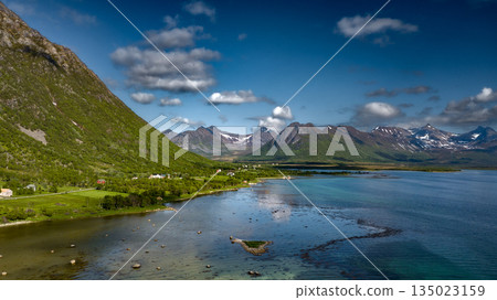 Coastal Landscape In Aerial View With Fjord And Snowy Mountains On Lofoten Islands In Norway Coastal Landscape In Aerial View With Fjord And Snowy Mountains On Lofoten Islands In Norway 135023159