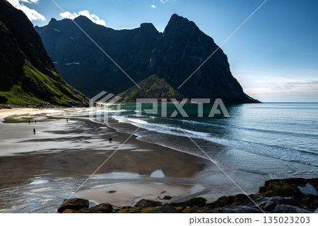 Kvalvika Sand Beach With Mountains And Ocean On Lofoten Islands In Norway Kvalvika Sand Beach With Mountains And Ocean On Lofoten Islands In Norway 135023203