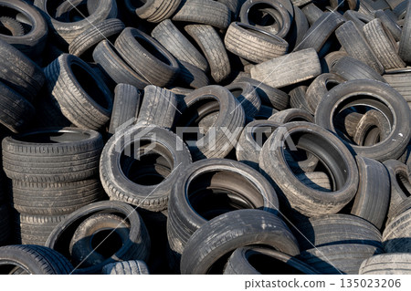 Chaotic Pile Of Discarded Car Tires Waiting For Reuse Or Recycling Chaotic Pile Of Discarded Car Tires Waiting For Reuse Or Recycling 135023206