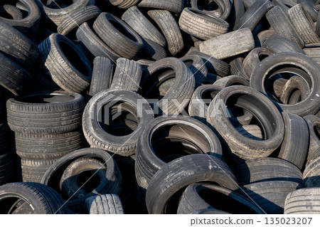 Chaotic Pile Of Discarded Car Tires Waiting For Reuse Or Recycling Chaotic Pile Of Discarded Car Tires Waiting For Reuse Or Recycling 135023207