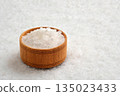 Salt crystals in a wooden bowl close-up 135023433