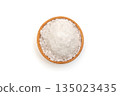 A bowl of sea salt on a white background. 135023435