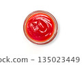 Tomato ketchup on a white background, top view 135023449