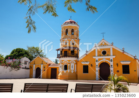 The beautiful historic Church of Santa Barbara built in 1613 with a balcony on its bell tower at the colonial Heritage Town of Santa Cruz de Mompox in Colombia. The beautiful historic Church of Santa Barbara built in 1613 with a balcony on its bell tower at the colonial Heritage Town of Santa Cruz de Mompox in Colombia. 135023600