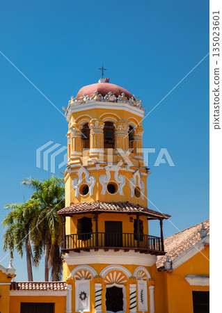 Bell tower and balcony of the beautiful historic Church of Santa Barbara built in 1613 at the beautiful colonial Heritage Town of Santa Cruz de Mompox in Colombia. Bell tower and balcony of the beautiful historic Church of Santa Barbara built in 1613 at the beautiful colonial Heritage Town of Santa Cruz de Mompox in Colombia. 135023601