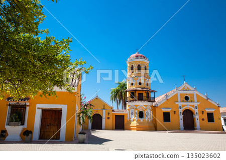 The beautiful historic Church of Santa Barbara built in 1613 with a balcony on its bell tower at the colonial Heritage Town of Santa Cruz de Mompox in Colombia. The beautiful historic Church of Santa Barbara built in 1613 with a balcony on its bell tower at the colonial Heritage Town of Santa Cruz de Mompox in Colombia. 135023602