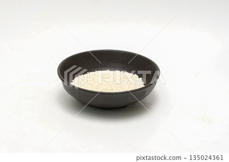 Sticky rice in a bowl on a white background Sticky rice in a bowl on a white background 135024361