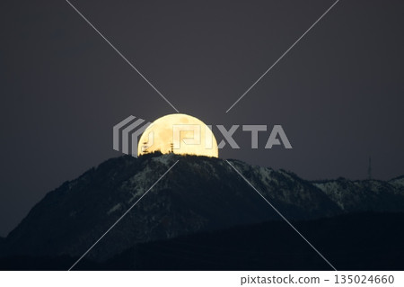 Medium-sized full moon rising from Matsumoto City's Utsukushigahara TV Tower 135024660