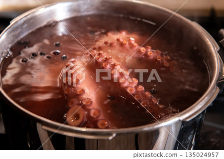 Boiled octopus cooking in stainless steel pot Boiled octopus cooking in stainless steel pot 135024957