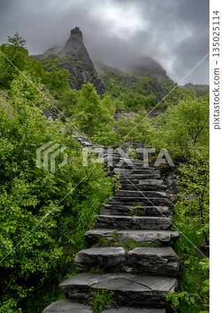 Hiking Path With Devils Stairs To Djevelporten The Devils Stone In Svolvaer On Lofoten Islands In Norway Hiking Path With Devils Stairs To Djevelporten The Devils Stone In Svolvaer On Lofoten Islands In Norway 135025114