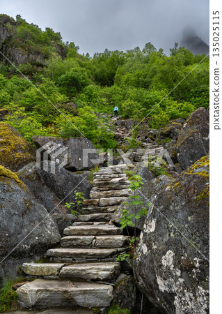 Hiking Path With Devils Stairs To Djevelporten The Devils Stone In Svolvaer On Lofoten Islands In Norway Hiking Path With Devils Stairs To Djevelporten The Devils Stone In Svolvaer On Lofoten Islands In Norway 135025115