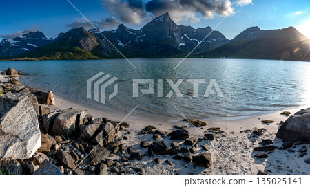White Sand Beach And Snowy Mountains At Calm Fjord Near Leknes On Lofoten Islands In Norway 135025141