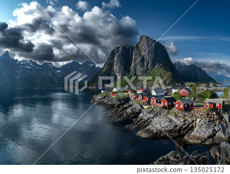 Picturesque Coastal Village Hamnoy With Red Rorbuer Huts On Lofoten Islands In Norway Picturesque Coastal Village Hamnoy With Red Rorbuer Huts On Lofoten Islands In Norway 135025172